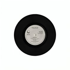 a black and white record with the word's on it, in front of a white background