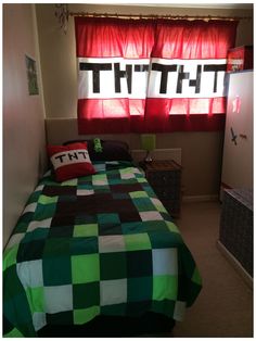 a green and black checkered bedspread on a bed in front of a window