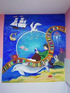 a painting on the wall of a child's room with a dolphin and boat