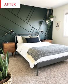 a bed room with a neatly made bed and a potted plant next to it