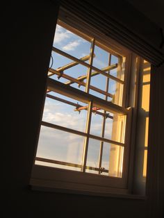 an airplane is flying in the sky through a window