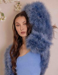 Once in a while, right in the middle of an ordinary life, loves gives you a fairytale. Whether you are a lady that embraces elegance, grace and finesse with polished style or a gorgeous winter bride, be sure to find your special piece to compliment your style. Hand Dyed Luxurious Marabou Feather Jacket Hook/eye front closure Cropped style design with rounded front and 3/4 length sleeves Made from Ethically sourced 100% Feathers Silk Satin Lining Lightweight Made of by-product materials Elegant Blue Outerwear For Wedding, Blue Winter Outerwear For Evening, Chic Winter Wedding Outerwear, Spring Wedding Blue Outerwear, Blue Spring Wedding Outerwear, Elegant Winter Feathered Outerwear, Cropped Fluffy Jacket, Luxury Women's Feathered Outerwear, Luxury Feather-trim Fur Coat For Evening