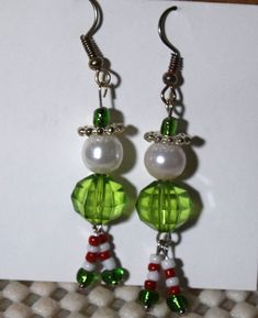 These elf pierced earrings are approximately 2.5 inches long. They are a fun Christmas gift or just fun to wear. www.etsy.com/shop/ItsMyDesign Fun Green Beaded Earrings For Gift, Green Fun Beaded Earrings For Gift, Green Dangle Earrings For Holidays, Handmade Green Earrings For Holidays, Elf Earings, Christmas Green Earrings With Dangling Beads, Elf Earrings, Green Elf, Angel Earrings