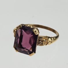 Vintage 1940s 10k gold purple stone ring. The size of the ring is 6.25 and can be sized. Wedding Ring With Purple Stones, Luxury Antique Purple Amethyst Ring, Luxury Classic Amethyst Ring With Polished Finish, Purple Garnet Ring, Wedding Ring Purple Stone, Antique Amethyst Ring Gold, Gold And Amethyst Ring, Luxury Handmade Gold Amethyst Ring, Antique 14k Gold Amethyst Ring