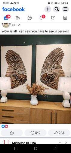 two framed pictures with birds on them in front of a dresser and table lamp next to each other