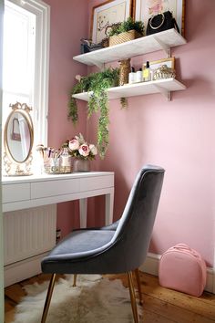 a chair sitting in front of a desk with a mirror on top of it next to a window