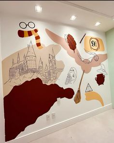 a large mural on the side of a building with harry potter symbols painted on it