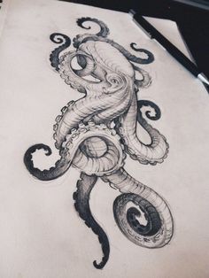 an octopus drawing on paper with a pen in it's mouth and the tentacles are curled up