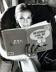 a woman sitting in a chair reading a book with the caption reading can be fun