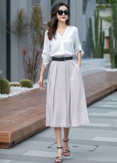 "DETAIL * 50% linen, 50% cotton * Seam pockets * Belt loops * Right zipper closure * A Line skirt * Wash by hand or machine with cold water * Belt is not sale items * The model is 170cm (5′7″) tall with a 80cm (31.5\") bust, 66cm (26\") waist. She is wearing the Khaki skirt in size XS. * Choose CUSTOM Order if you Can't find your size in our size Chart Chang the Length Your Height is not Between 5'1\" - 5\"9\" Your weight is not Between 45kg - 75kg SIZE GUIDE Size vary between Brand and Country Casual A-line Skirt For Daywear, Summer Workwear Knee-length Skirt, Long Pleated Skirt For Summer Daywear, Summer Long Pleated Skirt For Daywear, Long Relaxed Skirt For Office, A-line Skirt For Office In Spring, Spring Office Maxi Skirt With Lining, Spring Office A-line Skirt, Summer Office Bottoms Knee-length