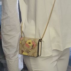 100% Authentic Or Money Back Guarantee !!! Coach Ch714 Mini Wallet On A Chain In Signature Canvas With Floral Cluster Print Gold/Light Khaki Multi Signature Coated Canvas And Smooth Leather Two Credit Card Slots Snap Closure, Fabric Lining Outside Open Pocket Detachable Chain Strap With 23 1/4" Drop For Shoulder Or Crossbody Wear 4" (L) X 3" (H) X 1" (W) Style No. Ch714 Coach Wallet On Chain For Everyday Use, Chic Beige Wallet On Chain With Chain Strap, Beige Wallet On Chain For Everyday Use, Gold Rectangular Wallet On Chain For Everyday Use, Gold Wallet With Chain Strap, Gold Wallet On Chain For Everyday Use, Chic Coach Rectangular Wallet On Chain, Coach Wallets With Chain Strap For Everyday Use, Beige Rectangular Wallet On Chain For Everyday Use