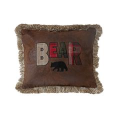 a brown pillow with the word bear on it