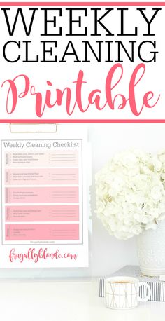 a printable weekly cleaning checklist on a white table with flowers and a vase