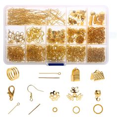 a box filled with lots of different types of gold colored jewelry and accessories in it