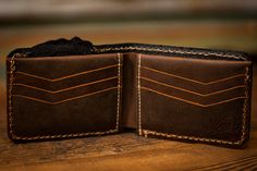 These wallets are cut from high quality vegetable tanned leather, carved, tooled, dyed, stitched, and finished with a protective coating to protect the leather and dye work. The freeform top edge has been wax-hardened for longevity. Colors may vary slightly due to the handmade nature. Made to last. Made with love. Turkey Tail Mushroom, Tooled Leather Wallet, Brown Interior, Leather Bifold Wallet, Vegetable Tanned Leather, Leather Tooling, Tan Leather, Colorful Interiors, Leather Wallet