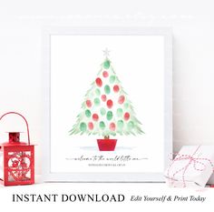 a watercolor christmas tree is displayed in front of a red lantern