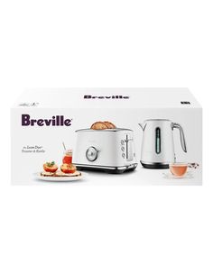 the breville toaster is in its box and ready to be used for breakfast