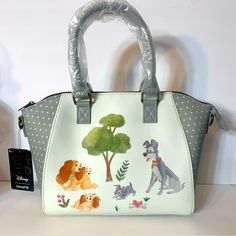 Nwt. Loungefly Lady And The Tramp Disney Watercolor Satchel Or Crossbody Bag. Faux Leather Shell, With Fabric Interior Lining. Front Zipper Pocket. Adjustable Shoulder Straps. Top Carry Handles. Approx. 9”H X 10.5l X 4.5”W. Adjustable Detachable Crossbody Strap, Interior Drop Pocket And Top Zipper Closure. Adorable Pics Of Lady And The Tramp With Their Puppies. Disney Bags For Daily Use, Daily Disney Style Bag, Disney Satchel Bag For Everyday Use, Green Disney Style Bags For Daily Use, Green Disney Bags For Everyday Use, Disney White Bags For Disney Trips, Disney White Travel Shoulder Bag, Disney Style White Shoulder Travel Bag, White Disney Bags For Everyday Use