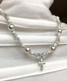 First Communion to Wedding Necklace-- pair this necklace with the matching bracelet: https://www.etsy.com/listing/577480610/first-communion-gift-first-communion-to?ref=shop_home_active_10» » » » WHAT YOU RECEIVE WITH YOUR PURCHASE «  «  « «° Necklace with solid sterling silver beads and spacers° Necklace with solid sterling silver cross charm° Necklace with solid sterling silver chain, clasp, and findings° Necklace with Swarovski crystal pearls° Necklace with Swarovski crystals° Solid sterling s Silver Beaded Jewelry For Baptism, Elegant Pearl Jewelry For Confirmation, Silver Cross Jewelry For Confirmation, Silver Spiritual Jewelry For First Communion, Elegant Beaded Jewelry For Baptism, Spiritual Silver Jewelry For First Communion, Spiritual Pearl Jewelry For Baptism, Elegant Pearl White Jewelry For First Communion, Beaded Cross Jewelry For First Communion