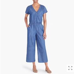 J.Crew Mercantile Women's Short-Sleeve Chambray Wrap Jumpsuit 100% Cotton Imported No Closure Closure Machine Wash Fitted At Waist Back Zip Slant Pockets J. Crew Mercantile's Versatile Staples, Perfected Over Decades. Timeless Classics, Everyday Necessities, And Statement Pieces That Become Your Go- Hang Denim Blue Short Sleeve Relaxed Fit Jumpsuits And Rompers, Casual Indigo Denim Jumpsuit, Spring V-neck Denim Jumpsuit With Pockets, Casual Denim Blue Jumpsuits And Rompers For Work, Summer Workwear Denim Jumpsuit In Medium Wash, Spring Indigo Denim Jumpsuit With Pockets, Summer Denim Jumpsuit In Medium Wash For Work, Summer Workwear Medium Wash Denim Jumpsuit, Summer Medium Wash Denim Jumpsuit For Work