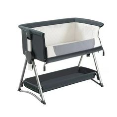 a black and white baby crib with grey trim