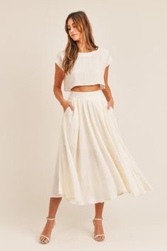 A neutral staple to instantly upgrade any outfit! Our This Is Bliss Cream Midi Skirt is a flowy midi skirt, lined at the top, has a fitted waist with elastic in the back, pleats in the front, and functional pockets. Model is wearing a size Small. Summer Two Piece Outfits, Night Skirt, Flowy Maxi Skirts, Fit And Flare Skirt, Crop Top Set, Midi Flare Skirt, Puff Sleeve Crop Top, Flowy Skirt, Mode Inspiration