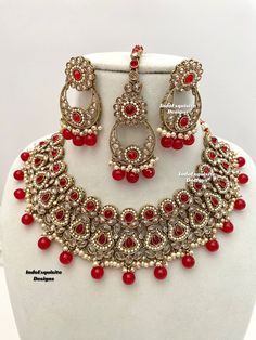 Gorgeous antique gold Polki necklace Set comes with earrings and Tikka/Indian Jewelry/ High quality kundan Polki jewelry/trendy choker/red  All items are shipped from Brampton, Ontario, Canada. If you need your item by a certain day, please reach out to us for express delivery option before placing the order so that we can update the shipping for you. Standard shipping/delivery timeline Below are the estimated delivery times after the order is shipped/dispatched.  ---> USA delivery timeline * 3- Red Kundan Necklace With Intricate Design For Ceremonial Occasions, Ceremonial Red Kundan Necklace With Intricate Design, Red Tikka With Intricate Design For Festive Occasions, Celebration Ruby Kundan Necklace With Chandbali Shape, Festive Gold Kundan Necklace With Ruby, Red Temple Jewelry Tikka For Gifts, Elegant Red Kundan Necklace, Ceremonial Red Kundan Necklace, Red Chandbali Tikka With Intricate Design