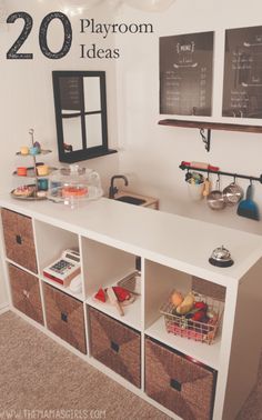 an organized playroom with baskets and chalkboard on the wall