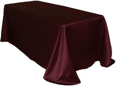 a table covered with a maroon cloth on top of a white background and black trim