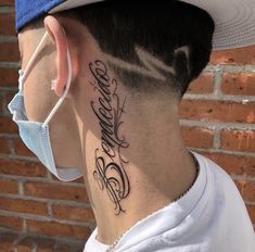 the back of a man's neck has a tattoo on it that reads, believe