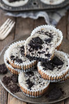 chocolate chip cookies and oreo cookie cupcakes on a plate next to a fork