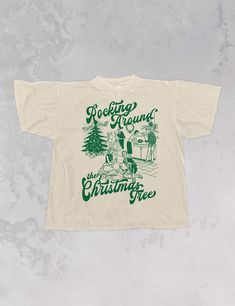 Start Rocking Around the Christmas Tree in our super cozy oversized tshirt, just in time for the Holiday season!- Features a Christmas party with the phrase "Rocking Around the Christmas Tree" around it all in a deep green ink- Screen print transfer that is individually heat pressed onto each tshirt- Printed on a vintage wash, super soft tshirt that gets softer with each wash- 100% Cotton- Oversized fit- Sizing translation: XS/S - L , S/M - XL , L/XL - 2XL , 2XL/3XL - 3XL**due to screens & filters color may vary from pictures** Retro Christmas Tshirt, Cool Christmas Shirts, Vintage Christmas Shirts, Sorority Christmas Shirts, Tshirt Trends 2024, Cricut Christmas Shirts, Christmas T Shirt Ideas, Christmas Tshirt Ideas, Crew Shirt Design