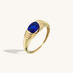 Majestic Sapphire Ring will be the ultimate symbol of your love. It is a perfect gift for your loved ones. - Made in 14k solid gold - Decorated with handset blue cubic zirconia stone on 14k solid gold - Bottom Width: 1.54 mm / 0.06 inches- Top Width: 5.57 mm / 0.21 inches- Thickness: 1.38 mm / 0.05 inches -This product comes with iconic Norm Jewels gift box Gold Decor, Sapphire Stone, Signet Ring, Loved Ones, Real Gold, Ring Bracelet, Rings Statement, Lab Grown, Sapphire Ring