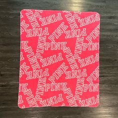 a pink and white towel with the words kingpin on it in different font styles