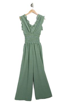 This wide-leg crepe jumpsuit that pairs pretty ruffles with flattering ruching is perfectly ready for the workday and after-hours events. 57" length (size Medium) Surplice neck Sleeveless Smocked waist 96% polyester, 4% spandex Machine wash, line dry Imported Green Smocked Back Jumpsuits For Spring, Green Smocked Back Jumpsuit For Summer, Green Sleeveless Ruffled Jumpsuits And Rompers, Spring Sleeveless Ruched Jumpsuits And Rompers, Sleeveless Ruched Jumpsuits And Rompers For Spring, Green Jumpsuit With Smocked Back, Chic Green Jumpsuit With Elastic Waistband, Spring V-neck Jumpsuits And Rompers With Smocked Back, Spring Jumpsuits And Rompers With Smocked Back And V-neck