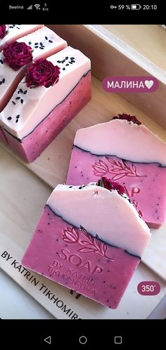 two pink soap bars with flowers on them