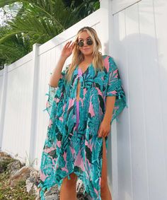 The ultimate tropical beach cover up for vacays and beach days, this cute swim cover up dress with tassel trim features a dreamy pink and green monstera leaf palm print. One size fit most. Hand wash & hang dry only Material: 100% Viscose Multicolor Swimwear With Palm Tree Print For Vacation, Multicolor Palm Tree Print Swimwear For Vacation, Pink Hibiscus Print Swimwear For Vacation, Tropical V-neck Beach Dress, Tropical Beach Dress With Tropical Print, Green Cover-up For Beach Party Vacation, Tropical Dresses With Tropical Print For Beach, Tropical Dresses With Palm Tree Print For Vacation, Beachy Green Cover-up With Tropical Print