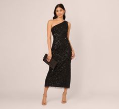 Go for glamor on your next evening under the stars in this beaded one shoulder dress. This formal dress features a one shoulder neckline, fitted bodice, and an ankle-length column skirt. Featuring our beloved allover sequin beading, this one shoulder gown is crafted from knit meshand fully lined. A zipper closure at the side of the dress completes the look. Trend-forward yet timeless, this ankle-length dress will shine for a formal night out with nude heels and a simple clutch. Style Number: AP1 One Shoulder Sequin Dress Black, Holiday Evening One-shoulder Dress, Black Embellished One Shoulder Party Dress, Embellished One-shoulder Evening Dress, Black One-shoulder Sequin Dress For Night Out, Black Dress Classy Elegant Long, Glamorous Black One-shoulder Sequin Dress, Black Embellished One-shoulder Party Dress, Simple Clutch