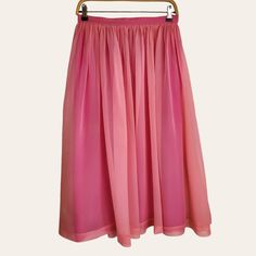 This handmade women's skirt features an outer layer of fine pink silk chiffon and is lined with a deeper pink taffeta. It is gathered at the waist and includes a zipper and hook-and-eye closure at the center back. The skirt drapes elegantly to mid-calf length (midi). To preserve its color and maintain the fabric's quality, dry cleaning is the best care method. The skirt exudes a dreamy, old-fashioned romanticism that will be a unique addition to your summer retro vintage collection. BRAND:  Hand Skirt Draping, Summer Retro, Rose Vintage, Retro Summer, Pink Silk, 1950s Vintage, Silk Chiffon, Vintage Pink, Vintage Collection