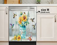 a dishwasher with sunflowers and hummingbirds on it in a kitchen