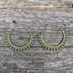 "These lovely beaded hoop earrings are made by carefully weaving beads around 45mm hoops, using the highest quality Miyuki glass beads. The gold beads are 24k gold plated, the hoops are 14k gold filled.    Handwoven Beadwork Miyuki glass beads - 24k gold plated  14k gold filled endless hoops - 45mm (LG) Extra durable nylon beading thread Size: 2\" long and 2 1/4\" wide Weight: 2.5g/each (5g/pair)" Bohemian Tiny Beads Hoop Earrings, Turquoise Earrings With Gold Beads, Festival Turquoise Earrings With Tiny Beads, Turquoise Earrings With Tiny Beads For Festivals, Bohemian Green Beaded Hoop Earrings, Turquoise Beaded Dangle Hoop Earrings, Turquoise Beaded Brass Jewelry, Festival Small Hoop Jewelry With Tiny Beads, Bohemian Hoop Earrings With Tiny Beads