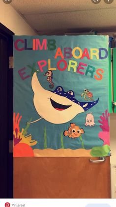 a classroom door decorated with an ocean theme