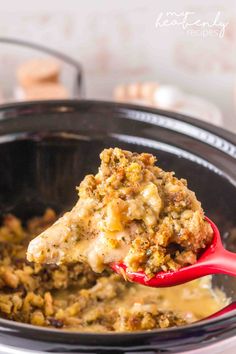 a spoon full of food in a crock pot