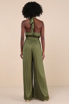 Leave everyone awestruck with the way you strut in the Lulus Confident Impression Olive Green Satin Pleated Halter Jumpsuit! Ultra-sleek, pleated satin shapes this impressive jumpsuit that features a tying halter neckline with a crisscrossing bodice that creates a flirty keyhole detail. Banded, fitted waist sits atop relaxed, wide pant legs that fall to ankle-length hems. Turn around to reveal a sexy open back design. Hidden back zipper/clasp. Fit: This garment fits true to size. Length: Floor length. Size medium measures 61" from top to bottom. Bust: Great for any cup size. Waist: Fitted - very fitted at natural waist. Hip: Not Fitted - room for hips. Undergarments: May be worn with an adhesive bra, petals, or no bra. Fabric: Fabric has no stretch. Lined. Shell: 95% Polyester, 5% Spandex. Elegant Sleeveless Pleated Jumpsuits And Rompers, Elegant Sleeveless Pleated Jumpsuit And Romper, Elegant Green Strapless Jumpsuit, Elegant Fitted Pleated Jumpsuits And Rompers, Pleated Fitted Jumpsuits And Rompers For Party, Elegant Pleated Jumpsuits And Rompers For Party, Chic Pleated Evening Jumpsuits And Rompers, Chic Pleated Jumpsuits And Rompers For Evening, Elegant Green Strapless Jumpsuit For Night Out