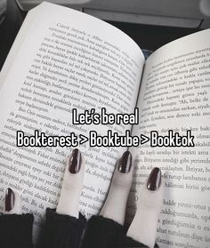 two hands holding an open book with the words let's be real bookstore = booktube