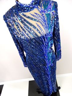 "This is a GORGEOUS Bob Mackie couture evening gown with exquisite detailing! It's in perfect condition! Bust - 36\" Waist - 30\" Hips - 40\" Dress Length - 57\" This dress comes from a pet-free and smoke-free home. If you would like more info or have any questions, please don't hesitate to ask!" Blue Glamorous Fitted Mother Of The Bride Dress, Glamorous Blue Fitted Mother Of The Bride Dress, Embellished Royal Blue Evening Gown, Blue Fitted Gown With Rhinestones, Fitted Blue Gown With Rhinestones, Royal Blue Embellished Evening Gown, Blue Fitted Mother Of The Bride Dress For Gala, Blue Sequined Fitted Gown, Blue Gown With Rhinestones For Party