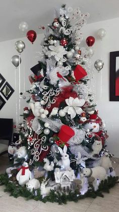 a christmas tree decorated with white and red ornaments