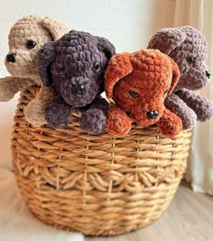 four stuffed animals in a wicker basket