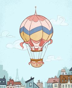 a hot air balloon flying through the sky over a small town with tall buildings on either side