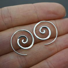 One pair of Tiny Minimalist Spiral Hoop Earrings.18mm diameter.Backings included. Material Options: Solid Sterling Silver Thick 18k Gold plating: 2 microns thick (industry standard is only 1 micron, making ours higher quality than standard gold plated jewelry). Made with depth, dimension, and taper, these are perfect simple tiny spiral earrings. The gold spiral is first cast in solid brass, expertly soldered to standard-size sterling silver ear-wire, and then entirely plated with 18K gold. All s Golden Spiral, Mother Of Pearl Earrings, Spiral Earrings, Sterling Silver Hoops, Silver Hoops, Minimalist Earrings, Piercing Jewelry, Cute Jewelry, Earrings Handmade